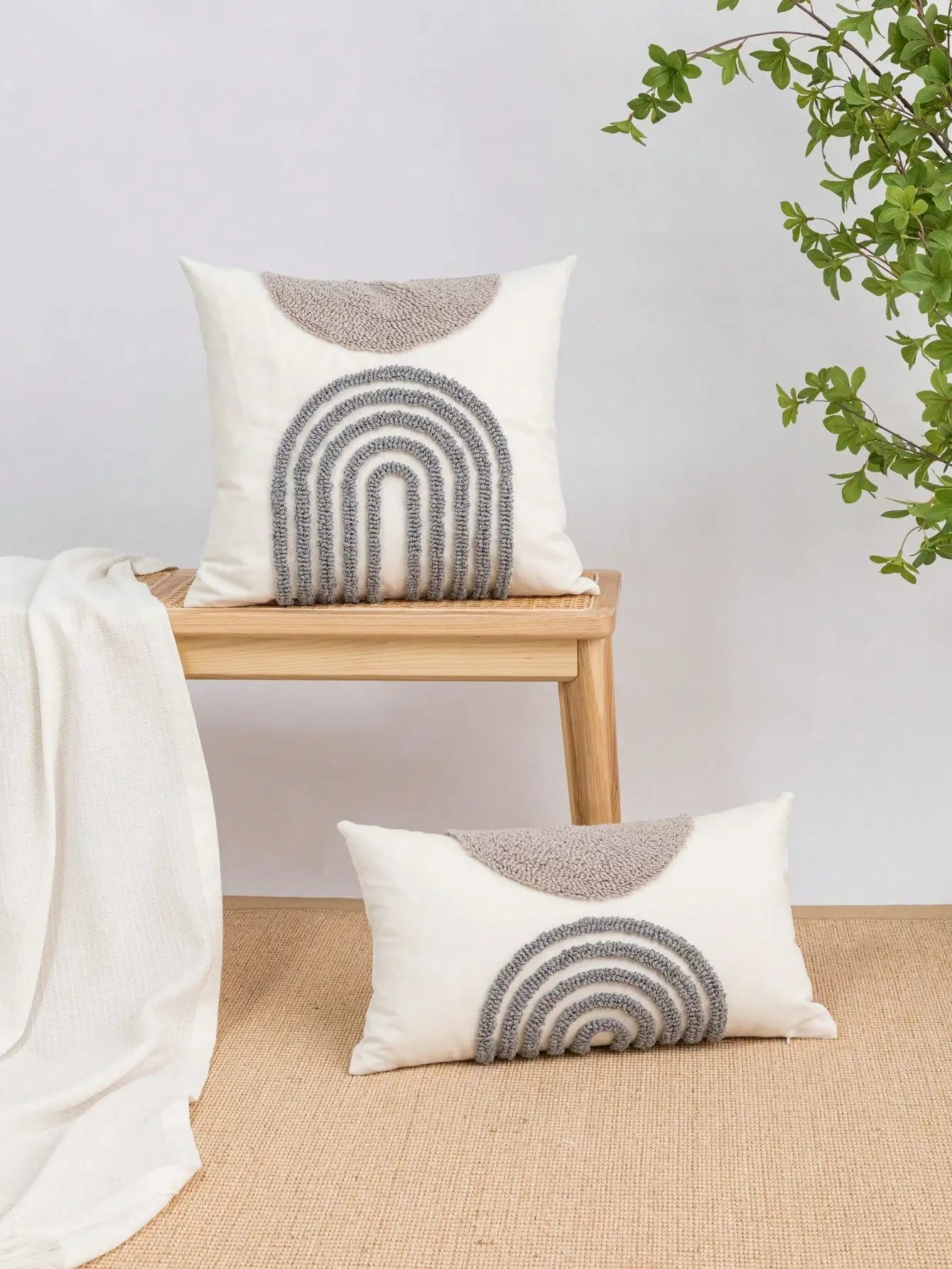Throw pillow cover with semicircular geometric patterns.